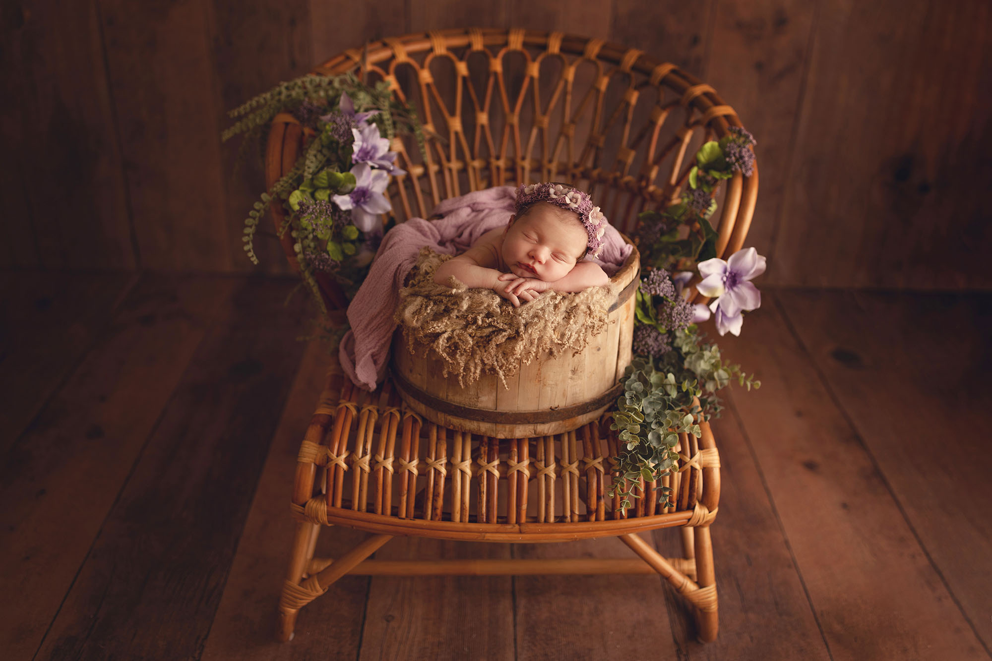 Baby posed on a boho chair